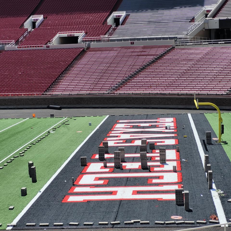 The turf design of Jones AT&T Stadium's north end zone is shown on Wednesday. The installation of Hellas' Matrix Helix Turf began last week, and Texas Tech officials have said that portion of the project should be completed in mid-August.