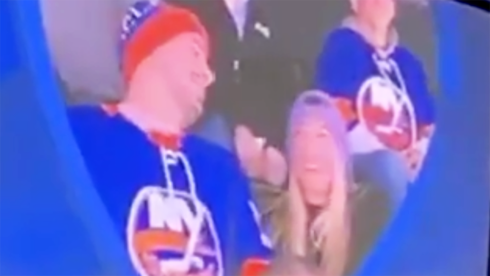 A New York Islanders fan, pictures, was mocked after pretending to propose to his partner, left.