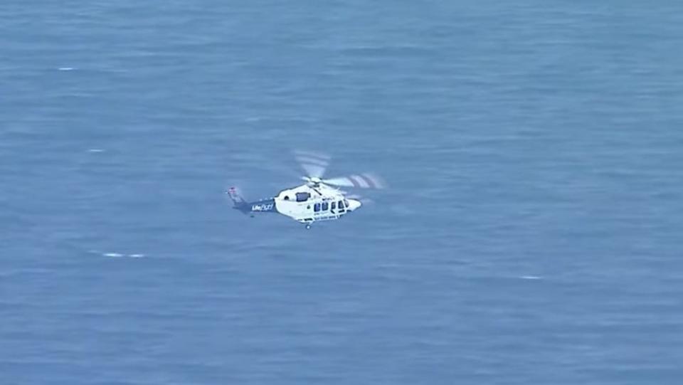 Queensland Paramedics and an RACQ Lifeflight rescue helicopter crew were called to help a 25-year-old man after he fell into a hole and was buried in sand on Bribie Island, north of Brisbane. Picture: NineNews