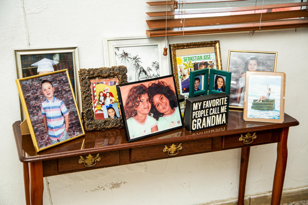 Family photographs of the grandchildren of Irma Martinez Rodriguez, 74, and Jose Luis Leon Figueroa, 67, at their home in Guanica, Puerto Rico, on May 29, 2023. (Erika P. Rodríguez for NBC News)