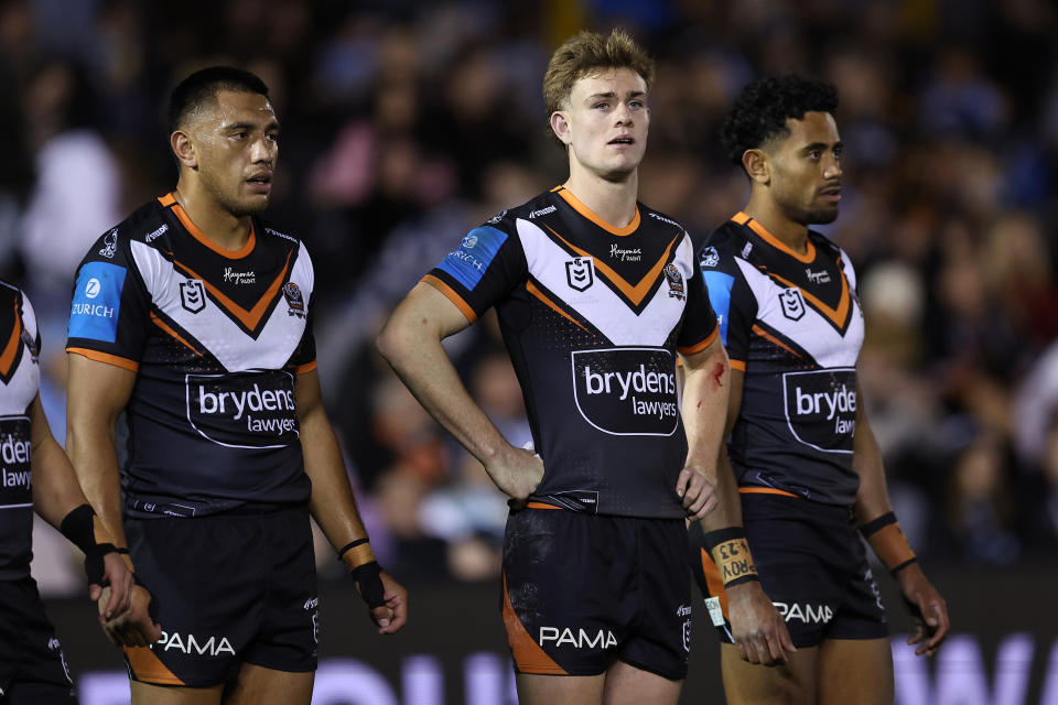 Wests Tigers players look on during their loss to Cronulla.