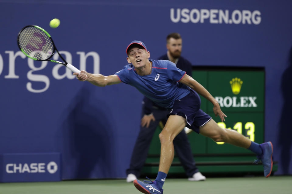 Alex de Minaur, of Australia, returns a shot against Marin Cilic, of Croatia, in a third-round match at the U.S. Open tennis championship, Saturday, Sept. 1, 2018, in New York. (AP Photo/Mark Lennihan)