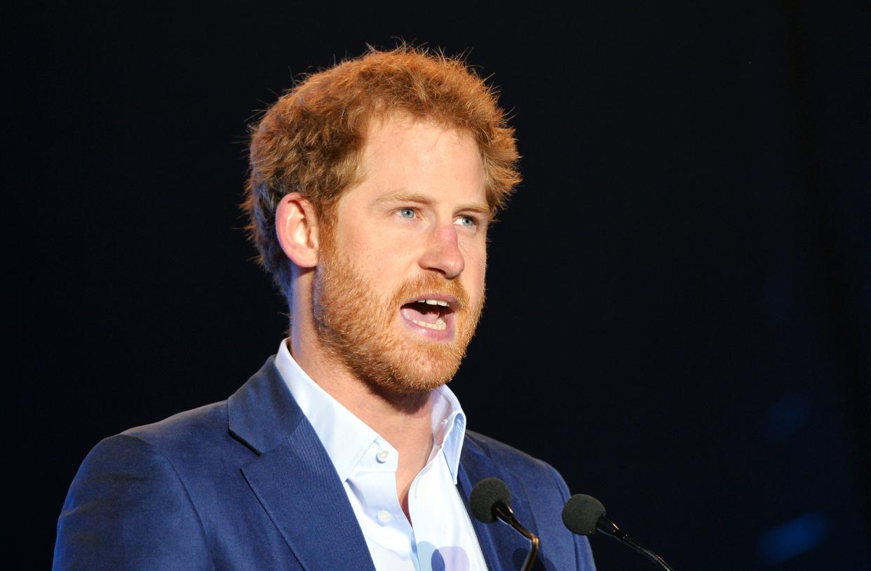 Britain's Prince Harry speaks on stage at the Sentebale Concert at Kensington Palace in central London on June 28, 2016 in London. - Prince Harry will be joined by co-founding Patron Prince Seeiso of Lesotho to watch the concert and will deliver a speech on stage during the evening. The event will raise funds to support Sentebale's work helping vulnerable young people in Lesotho and Botswana. (Photo by Dominic Lipinski / POOL / AFP) (Photo by DOMINIC LIPINSKI/POOL/AFP via Getty Images)