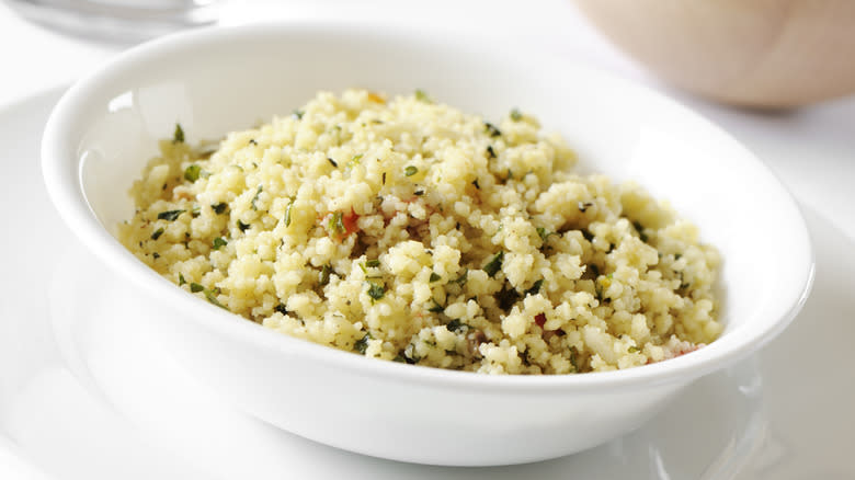 Herbed couscous in white bowl