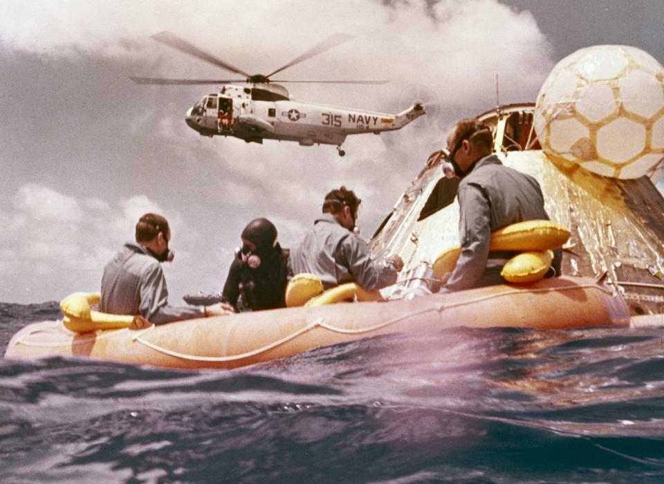 Sitting in the life raft, during the Apollo 12 Pacific recovery, are the three mission astronauts; Alan L. Bean, pilot of the Lunar Module (LM), Intrepid; Richard Gordon, pilot of the Command Module (CM), Yankee Clipper; and Spacecraft Commander Charles Conrad. The second manned lunar landing mission, Apollo 12 launched from launch pad 39-A at Kennedy Space Center in Florida on November 14, 1969 via a Saturn V launch vehicle. The Saturn V vehicle was developed by the Marshall Space Flight Center (MSFC) under the direction of Dr. Wernher von Braun. The LM, Intrepid, landed astronauts Conrad and Bean on the lunar surface in what?s known as the Ocean of Storms, while astronaut Richard Gordon piloted the CM, Yankee Clipper, in a parking orbit around the Moon. Lunar soil activities included the deployment of the Apollo Lunar Surface Experiments Package (ALSEP), finding the unmanned Surveyor 3 that landed on the Moon on April 19, 1967, and collecting 75 pounds (34 kilograms) of rock samples. Apollo 12 safely returned to Earth on November 24, 1969.