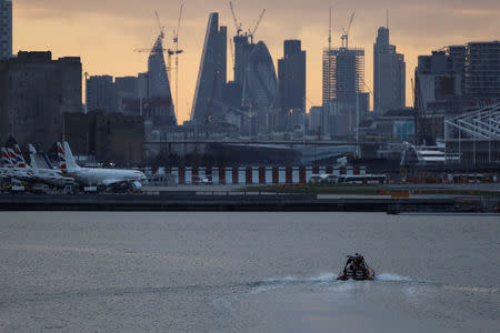 A bomb disposal team approach London City Airport, in London, Britain February 12, 2018. REUTERS/Simon Dawson