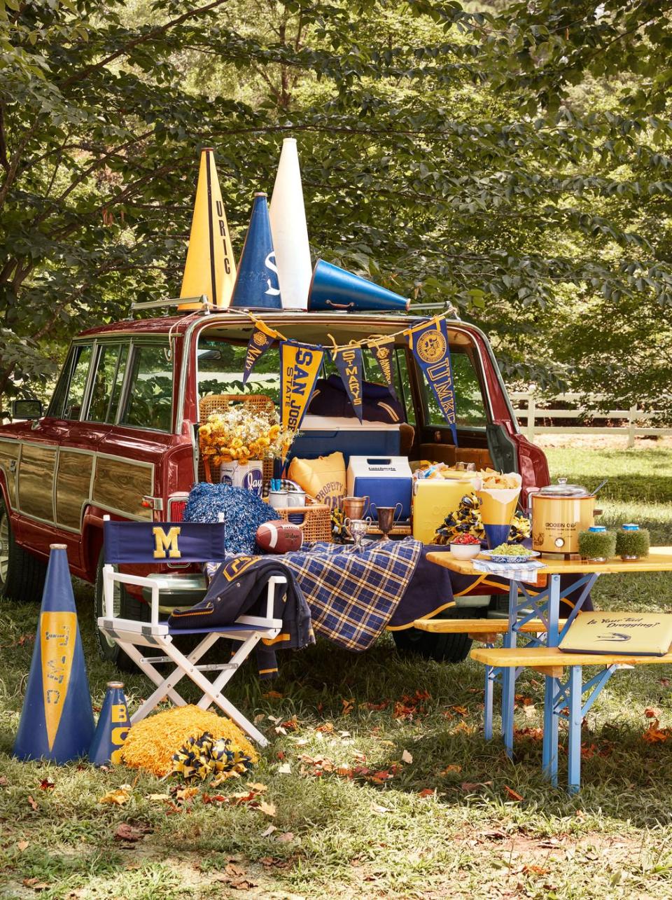 1984 grand wagoneer tailgating party with food and football memorabilia