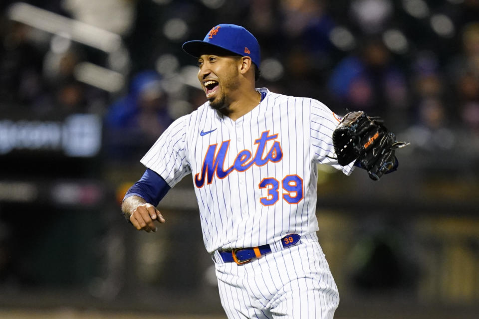 New York Mets relief pitcher Edwin Diaz (39) reacts after the first baseball game of a doubleheader against the Washington Nationals, Tuesday, Oct. 4, 2022, in New York. The Mets won 4-2. (AP Photo/Frank Franklin II)