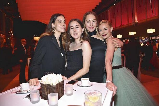 The band with Kate Bosworth at the Vanity Fair Oscars party