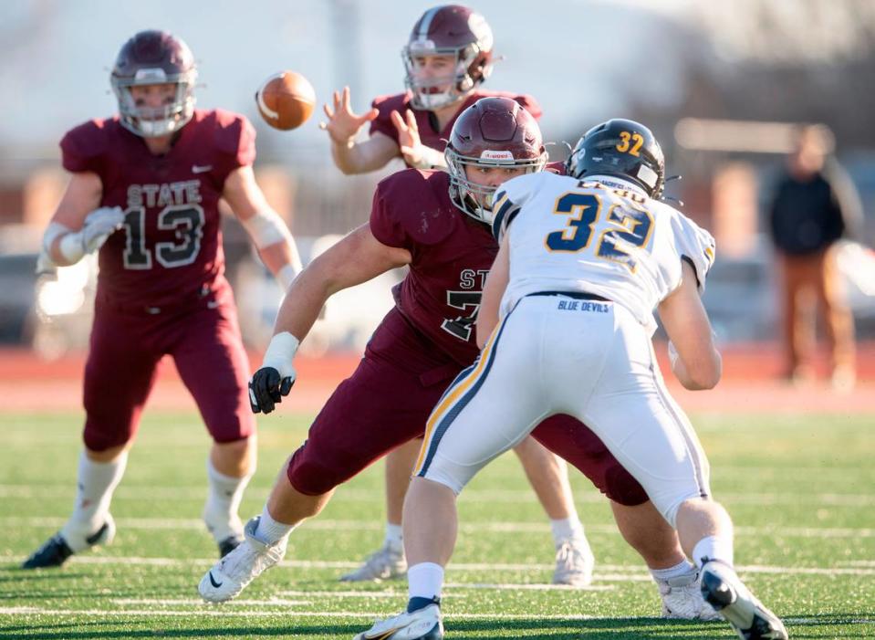 State College offensive lineman Michael Dincher blocks Mt. LebanonÕs Grayson Dee during the PIAA class 6A semifinal game on Saturday, Dec. 4, 2021 at Mansion Park. Mt. Lebanon won, 49-28.