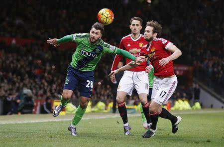 Football Soccer - Manchester United v Southampton - Barclays Premier League - Old Trafford - 23/1/16 Manchester United's Daley Blind in action with Southampton's Charlie Austin Reuters / Andrew Yates Livepic
