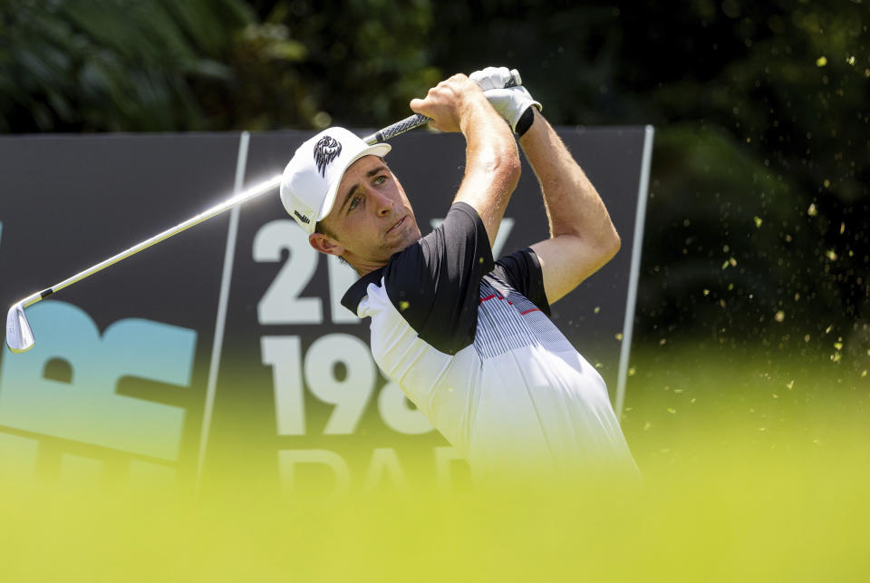 David Puig of Fireballs GC hits his shot from the eighth tee during the first round of LIV Golf Singapore at Sentosa Golf Club in Sentosa, Singapore, Friday, May 3, 2024. (Chris Trotman/LIV Golf via AP)