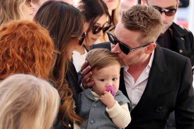 <p>Amy Sussman/Getty</p> Macaulay Culkin and Brenda Song sit with their younger son.