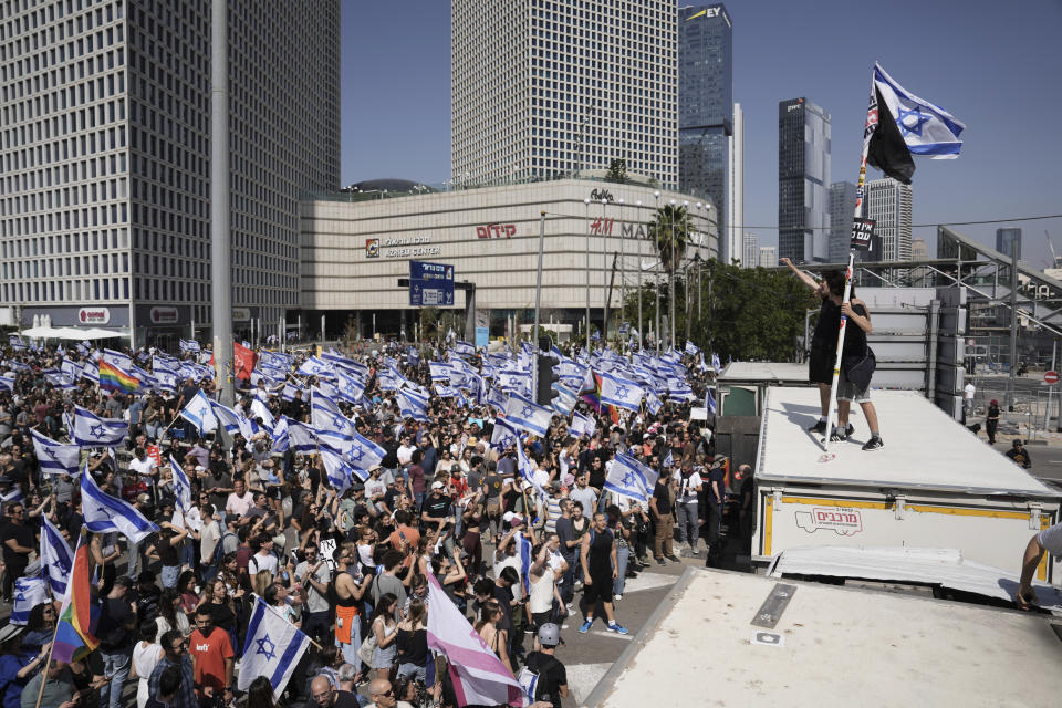 Israelis protest against plans by Prime Minister Benjamin Netanyahu's new government to overhaul the judicial system, in Tel Aviv, Israel, Wednesday, March 1, 2023. (AP Photo/Oded Balilty)