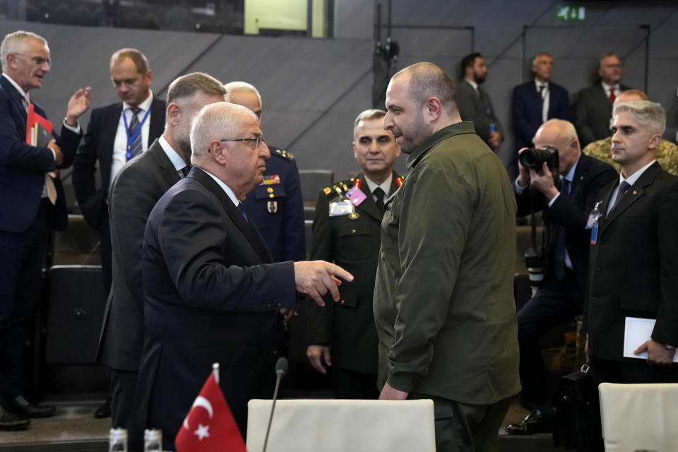 Ukraine's Defense Minister Rustem Umerov, center right, speaks with Turkey's Defense Minister Yasar Guler, center left, prior to a meeting of the NATO-Ukraine Council at NATO headquarters in Brussels, Wednesday, Oct. 11, 2023. Ukraine's President Volodymyr Zelenskyy and Ukraine's Defense Minister Rustem Umerov arrived at NATO for meetings with alliance defense ministers to further drum up support for Ukraine's fight against Russia. (AP Photo/Virginia Mayo)
