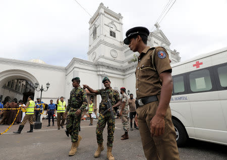 Sri Lankan military officials stand guard in front of the St. Anthony's Shrine, Kochchikade church after an explosion in Colombo, Sri Lanka April 21, 2019. REUTERS/Dinuka Liyanawatte