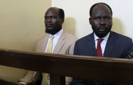 Kerbino Wol, a businessman, and Peter Biar Ajak, the South Sudan country director for the London School of Economics International Growth Centre based in Britain, sit inside the courtroom in Juba, South Sudan March 21, 2019. REUTERS/Stringer