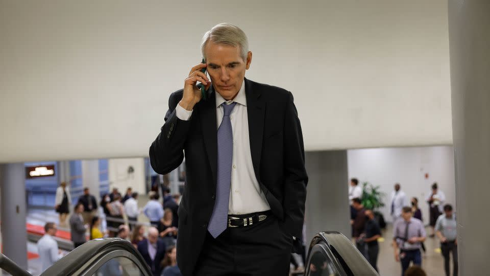 In this September 2022 photo, Sen. Rob Portman speaks on his phone as he walks through the Senate Subway during a vote in the US Capitol. - Anna Moneymaker/Getty Images