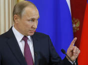 <p> Russian President Vladimir Putin speaks at a joint news conference with Moldovan President Igor Dodon in the Kremlin in Moscow, Russia, Tuesday, Jan. 17, 2017. President Vladimir Putin on Tuesday accused the outgoing U.S. administration of trying to undermine President-elect Donald Trump by spreading fake allegations. (Sergei Ilnitsky/Pool Photo via AP) </p>