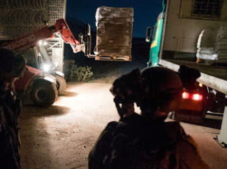 An undated image from material released on June 29, 2018 by the Israeli military relates to an Israeli humanitarian aid supply over the border to Syria. IDF/Handout via Reuters