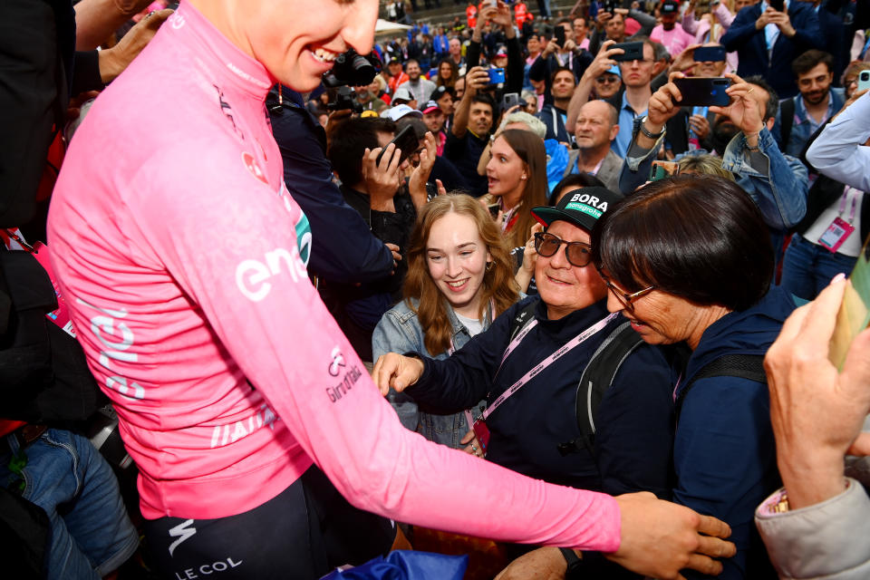 Pictured here, Aussie cyclist Jai Hindley of Australia celebrating with his parents after winning the 2022 Giro d'Italia