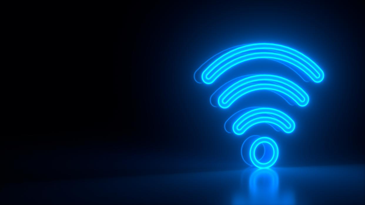  Futuristic glowing blue wi-fi symbol on black dark background with blurred reflection. 