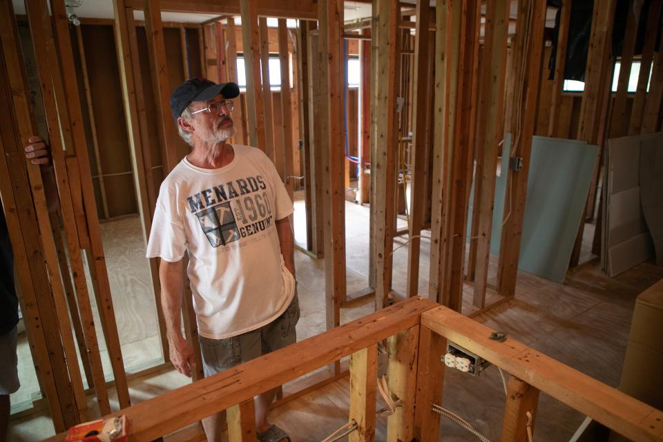David Bormuth stands in his rental condo off Island Park Road in Fort Myers on Thursday, Sept. 21, 2023. Bormuth and his wife own two condos in the neighborhood, and the construction company hired by the HOA only put in the sub-floors.