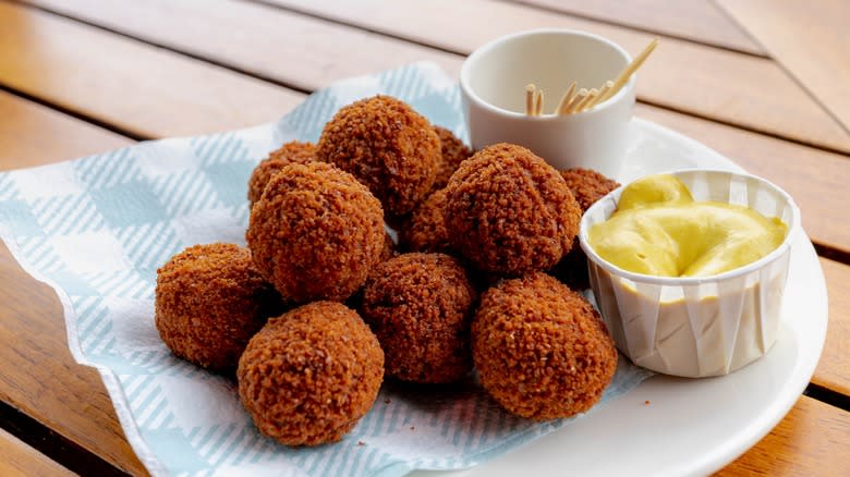 A plate of bitterballen with mustard