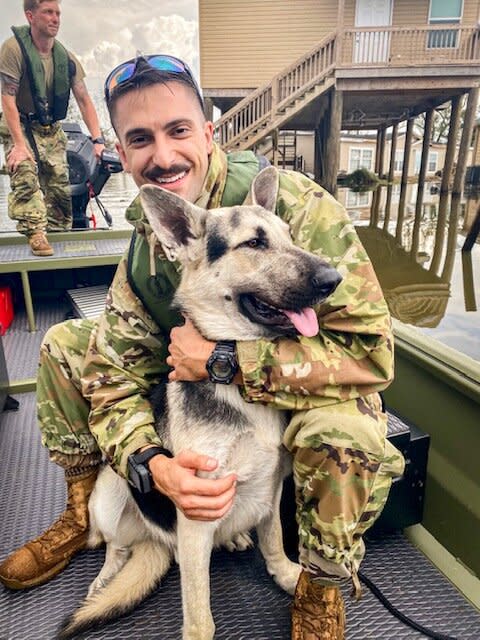 Louisiana Air National Guard Captain Ryan Mitchell and dog Caesar