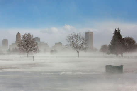 The city skyline is seen in drifting snow during the polar vortex in Buffalo, New York, U.S., January 31, 2019. REUTERS/Lindsay DeDario