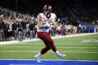 New Mexico State linebacker Eric Marsh scores on a pass reception against Bowling Green during the first half of the Quick Lane Bowl NCAA college football game, Monday, Dec. 26, 2022, in Detroit. (AP Photo/Al Goldis)