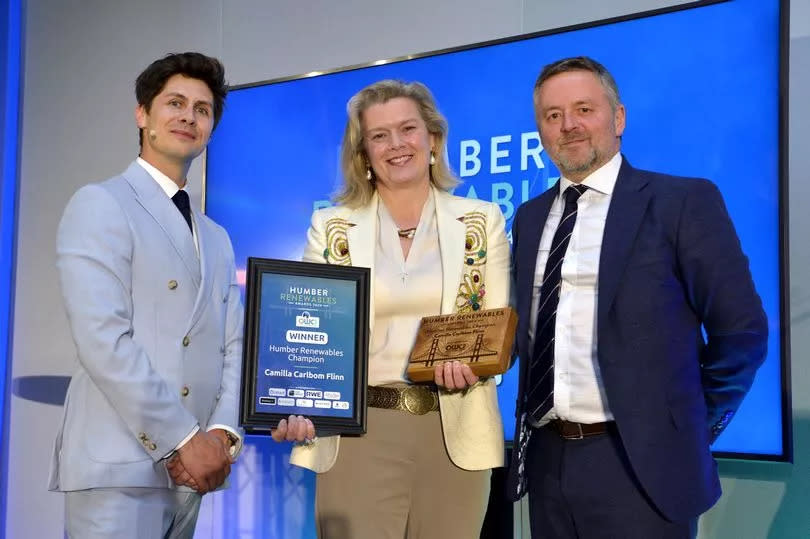 Humber Renewables Awards 2024: Camilla Carlbom Flinn, with her Humber Renewables Champion accolade, flanked by host Ben Hanlin, left, and Humber Marine and Renewables chair Iain Butterworth