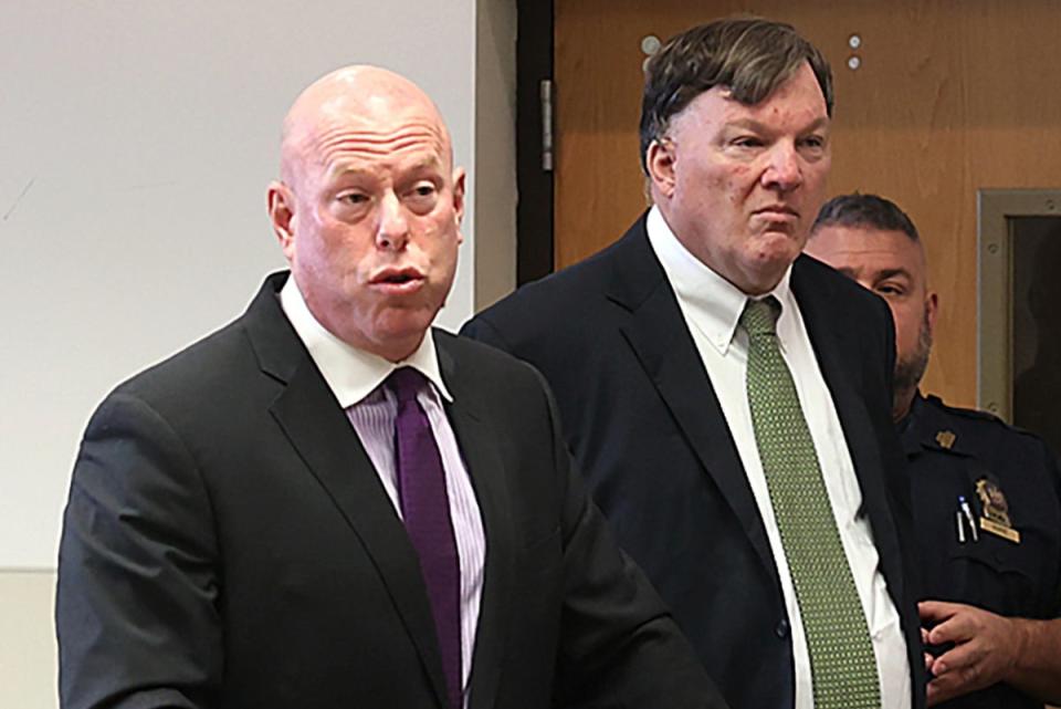 Rex Heuermann, right, appears in Suffolk County Supreme Court with his attorney, Michael Brown, on 14 November (AP)