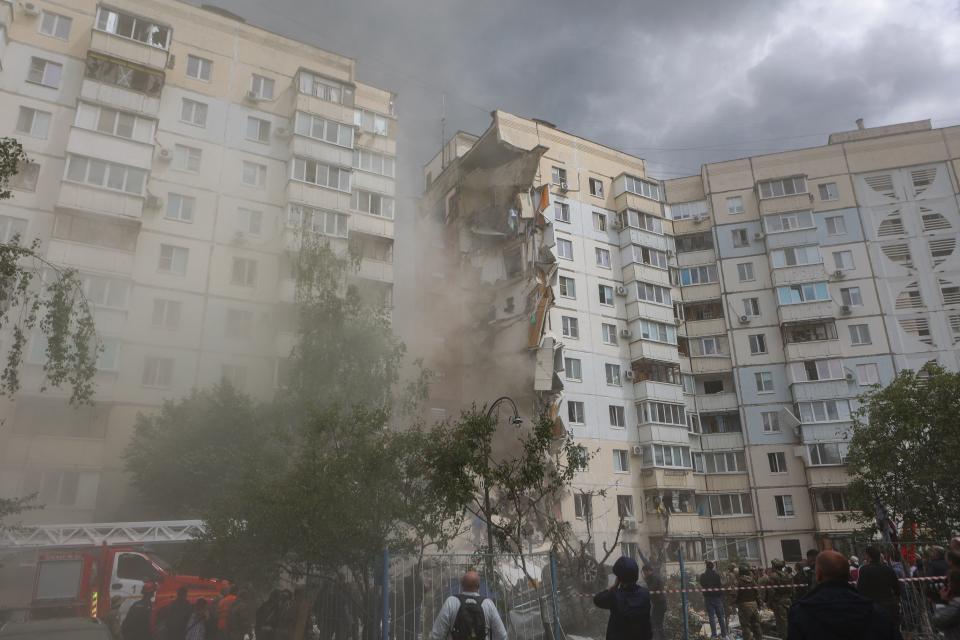 This photograph shows a view of a partially collapsed apartment building which was damaged by a Ukrainian strike in Belgorod on 12 May 2024 (AFP via Getty Images)