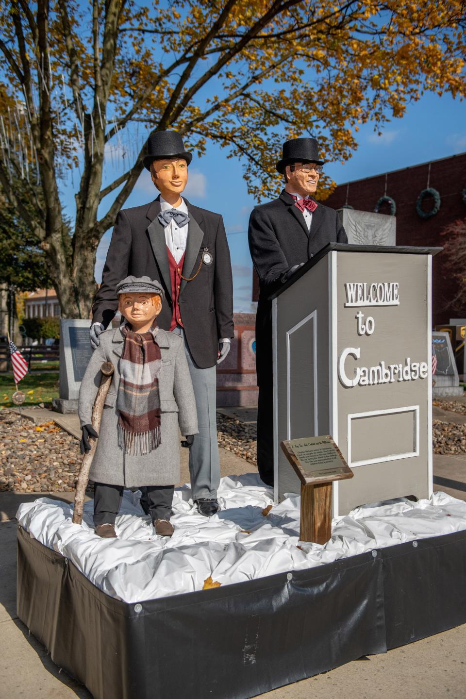 Dickens characters, including Tiny Tim, welcome visitors to Cambridge.