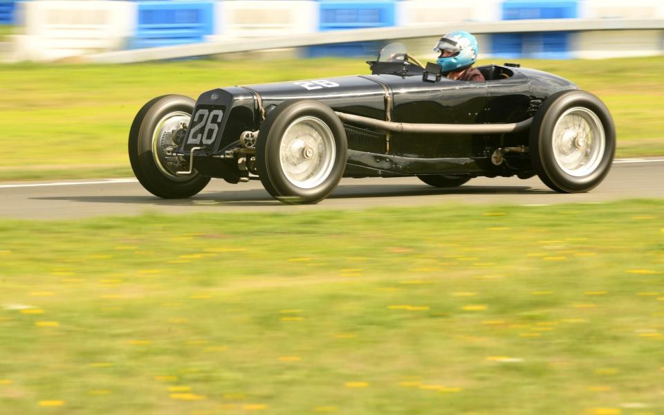 Aba Kogan, current owner of the Delage Model 15 S8, fastest track car in the 1927 British Grandprix drives the ninety five year old vehicle around the test track - Russell Sach