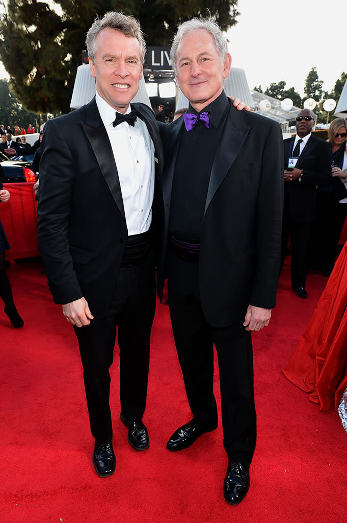 Tate Donovan and Victor Garber arrive at the 70th Annual Golden Globe Awards at the Beverly Hilton in Beverly Hills, CA on January 13, 2013.