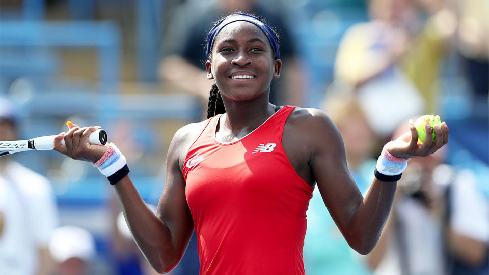 Cori Gauff laughs while hitting balls into the crowd after defeating Hiroko Kuwata of Japan during qualifying for the Citi Open at Rock Creek Tennis Center on July 28, 2019 in Washington, DC. (Photo by Rob Carr/Getty Images)