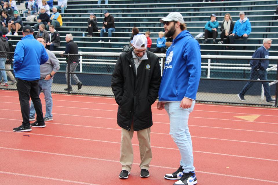 Former Jackrabbit Dallas Goedert chats with SDSU director of operations Jonathan Shaeffer on the sideline