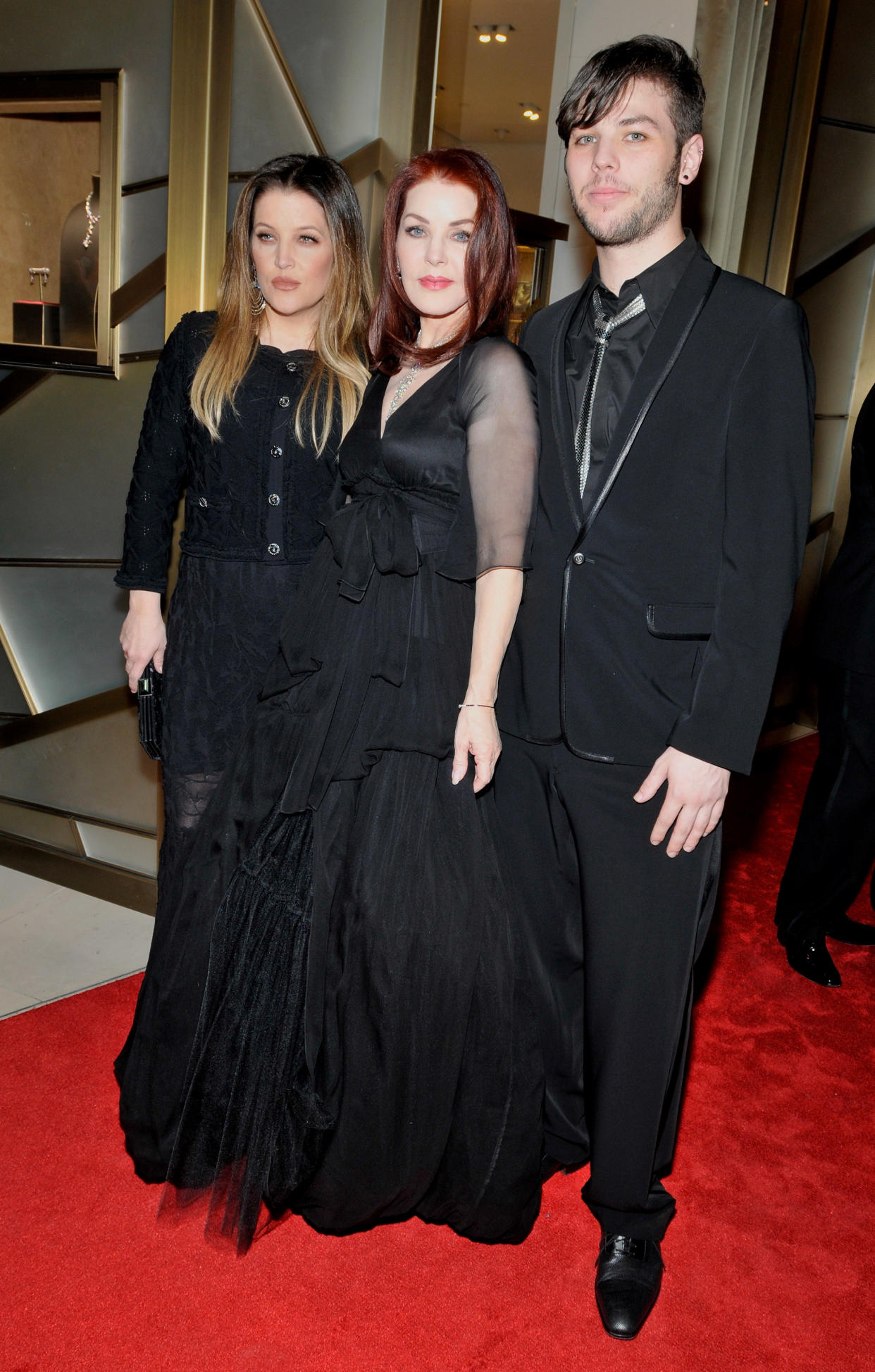 LAS VEGAS, NV - JANUARY 29:  (L-R) Lisa Marie Presley, Priscilla Presley and Navarone Garibaldi attend at a cocktail reception at Cartier inside Crystals at CityCenter prior to the annual Black & White Ball fund-raising event for the Nevada Ballet Theatre on January 29, 2011 in Las Vegas, Nevada.  Priscilla Presley was honored by being named &#39;Woman of the Year&#39;  (Photo by David Becker/WireImage)