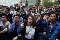 Pro-democratic winning candidates gather outside the campus of the Polytechnic University (PolyU) in Hong Kong