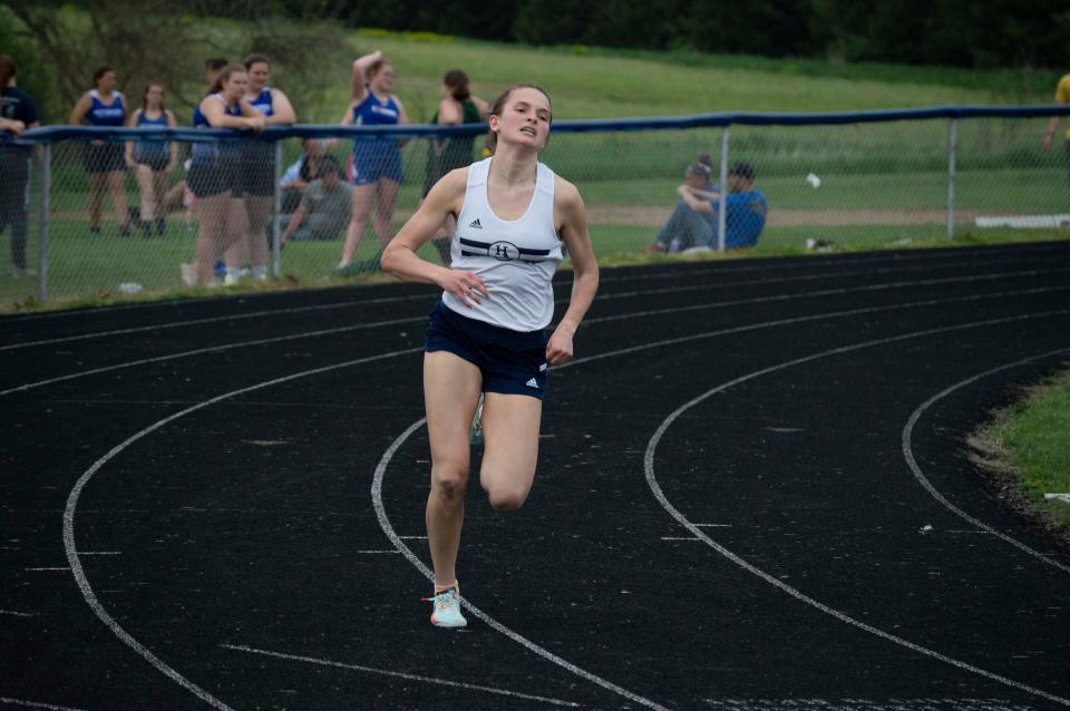 Hillsdale Academy Junior Megan Roberts leads the 400-meter sprint.