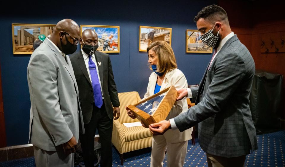 House Speaker Nancy Pelosi's office tweeted out this image on June 10 of Philonise Floyd, brother of George Floyd, receiving a flag that flew atop the US Capitol.