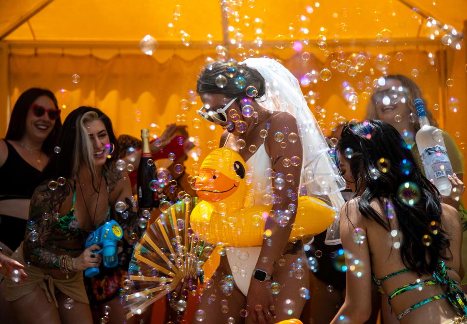 Bride-to-be Gories Kwong of San Francisco celebrates with friends and bridesmaids during weekend two of Splash House at The Saguaro in Palm Springs, Calif., Saturday, Aug. 13, 2022. Kwong will be married in the fall in Joshua Tree and wanted to spend her bachelorette party in the Coachella Valley. 