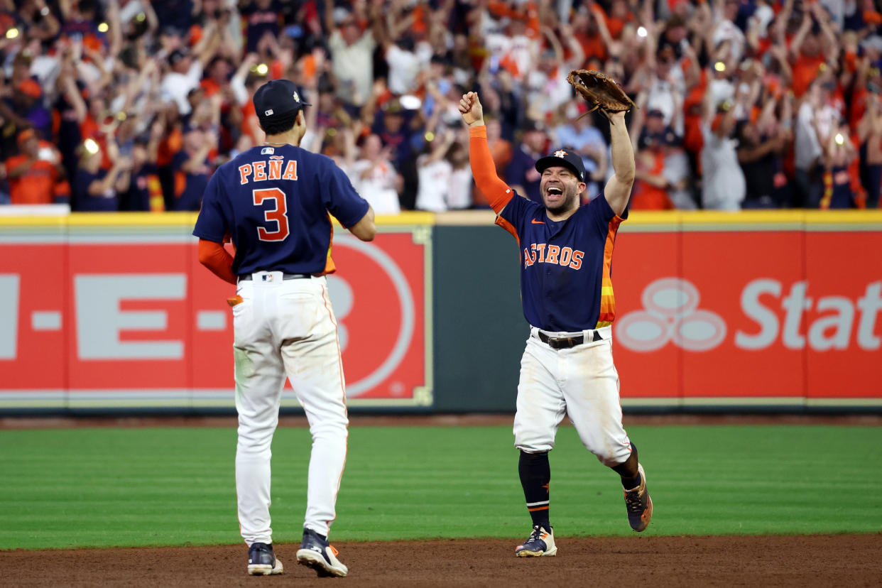 HOUSTON, TX - NOVEMBER 05:  Jeremy Peña #3 and Jose Altuve #27 of the Houston Astros celebrate after the Houston Astros defeated the Phillies, 4-1, in Game 6 of the 2022 World Series between the Philadelphia Phillies and the Houston Astros at Minute Maid Park on Saturday, November 5, 2022 in Houston, Texas. (Photo by Mary DeCicco/MLB Photos via Getty Images)