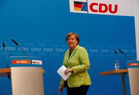 German Chancellor and leader of the Christian Democratic Union (CDU) Angela Merkel arrives for a news conference in Berlin, Germany, March 27, 2017. REUTERS/Fabrizio Bensch