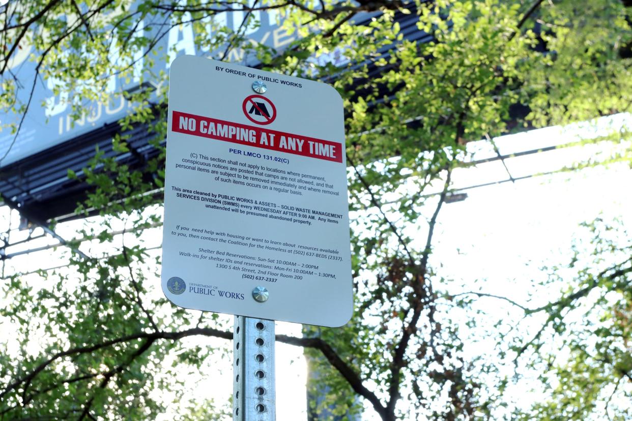 A no camping sign is posted in Louisville's Portland neighborhood, near a site where homeless camps are regularly set up.