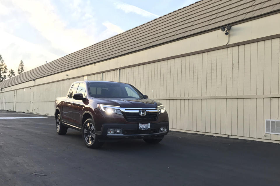 This photo provided by Edmunds shows a 2017 Honda Ridgeline. A 2017 or 2018 Ridgeline can be purchased for under $30,000 and reward drivers with a smooth ride and comfortable seating. (Courtesy of Edmunds via AP)