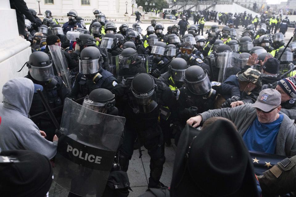 In this January 6, 2021, file photo, U.S. Capitol Police push back rioters trying to enter the U.S. Capitol in Washington.  / Credit: Jose Luis Magana / AP
