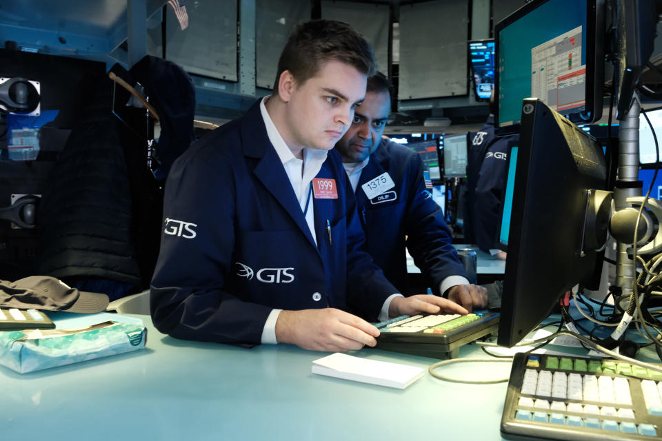 NEW YORK, NEW YORK - MARCH 11: Traders work on the floor of the New York Stock Exchange (NYSE) on March 11, 2022 in New York City. The Dow Jones Industrial Average was up over 200 points in morning trading on the last day of a volatile week for global markets.  (Photo by Spencer Platt/Getty Images)